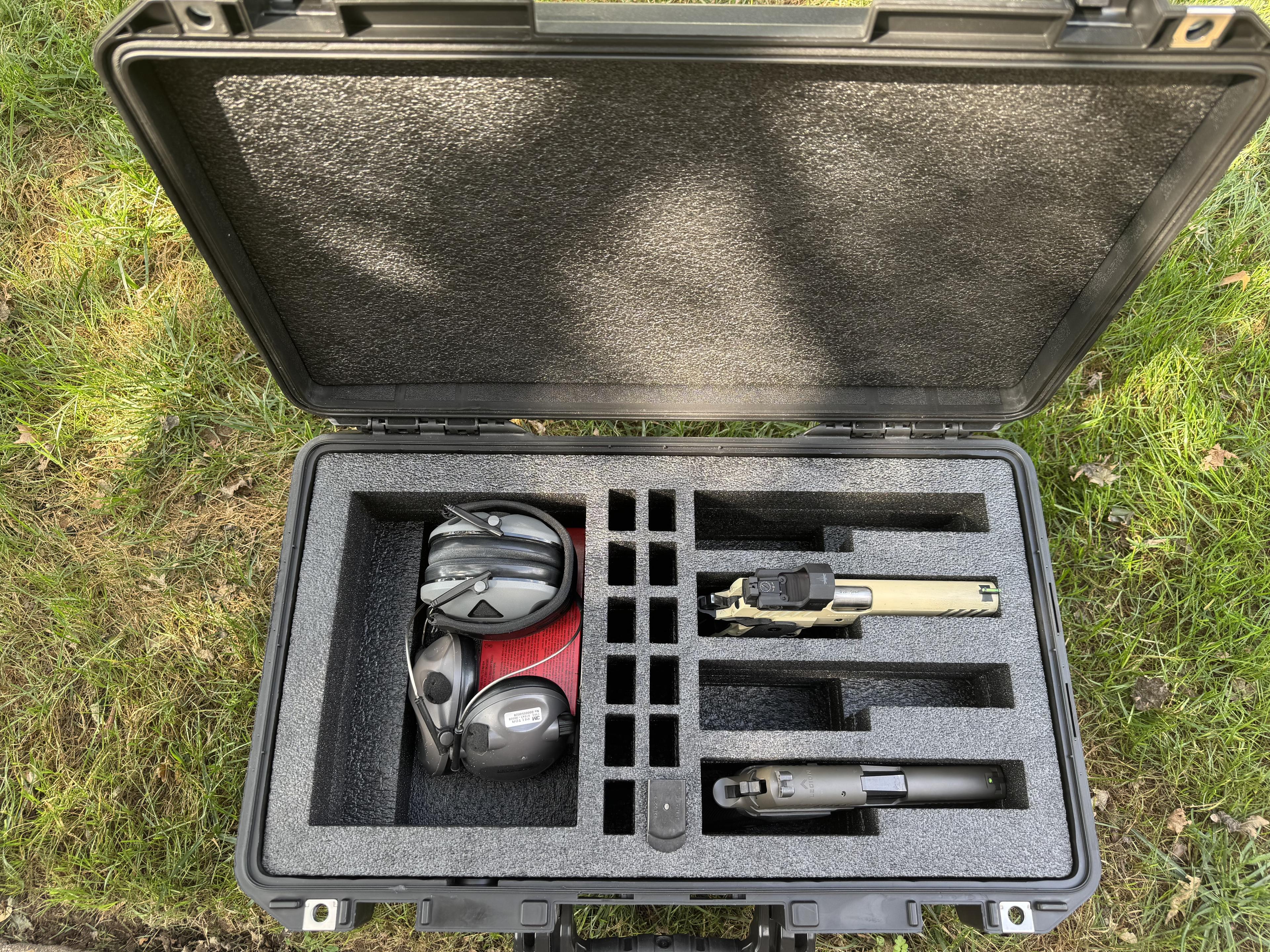 Custom foam insert for tactical case with pistol, ear protection, magazines, and suppressor